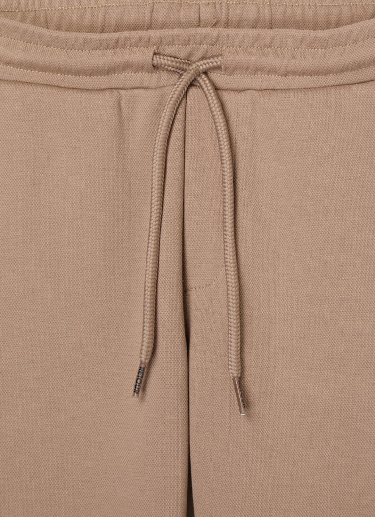 Calça de jogging slim fit Ralf da Retour Jeans com bolsos laterais.