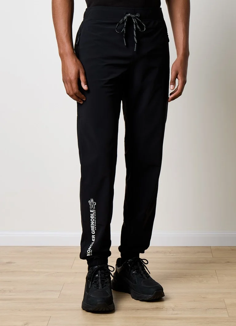 Teplákové nohavice Moncler zúženého strihu s vreckami na zips