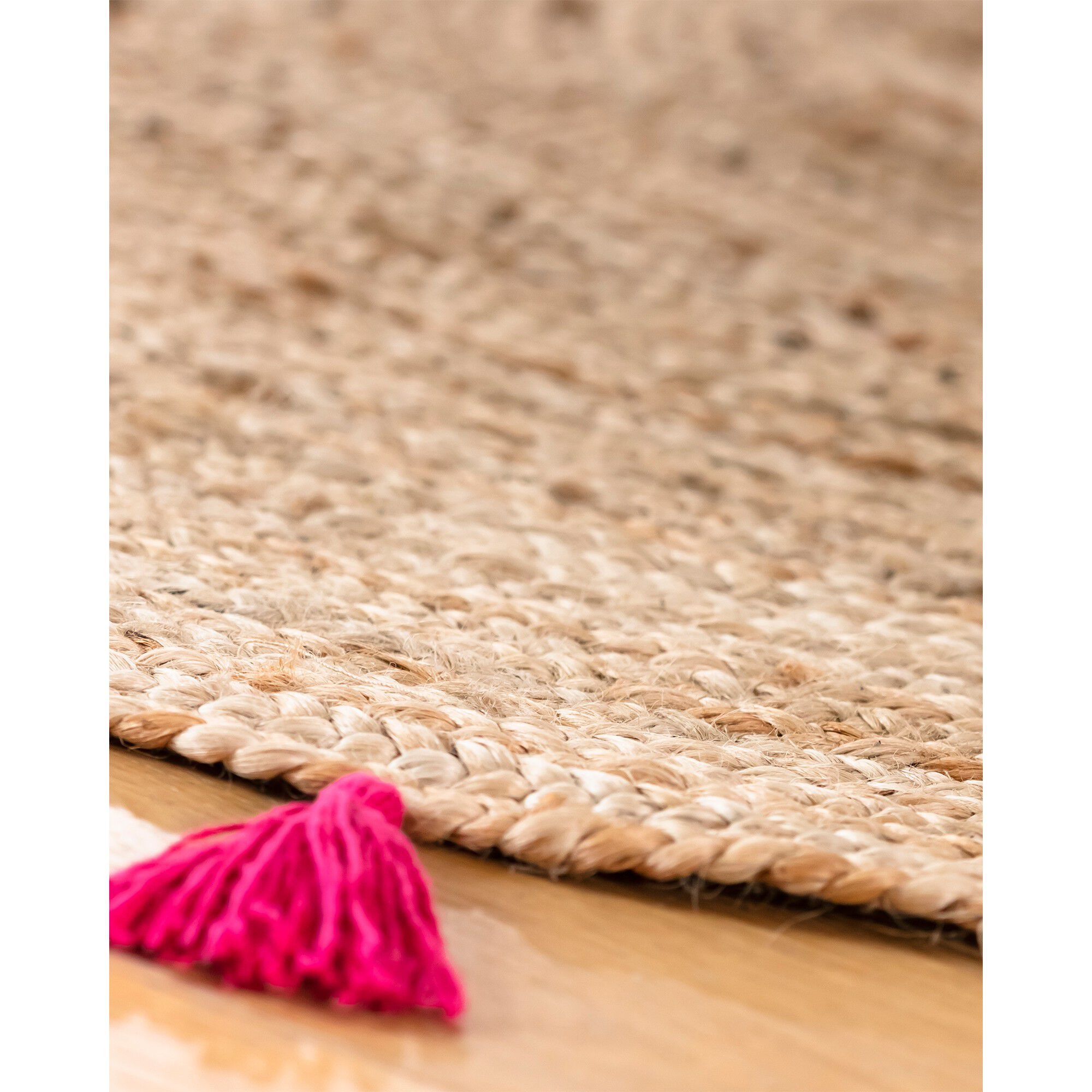 Tapis rond en jute avec pompons de couleur