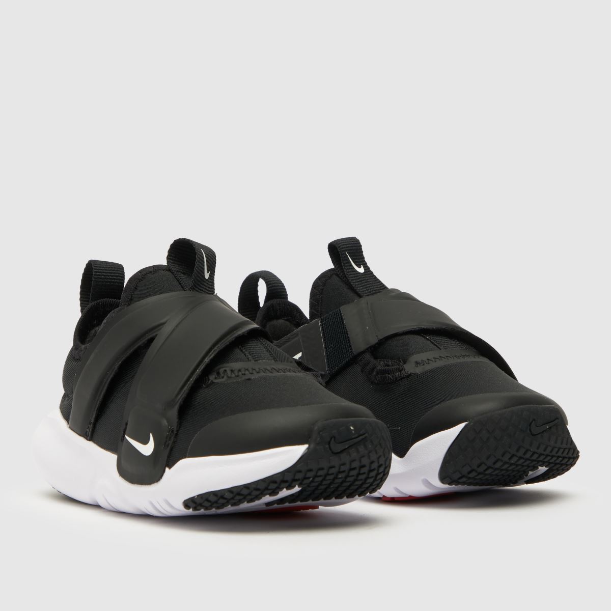 Nike Flex Advance sneakers i svart och vitt för småbarn