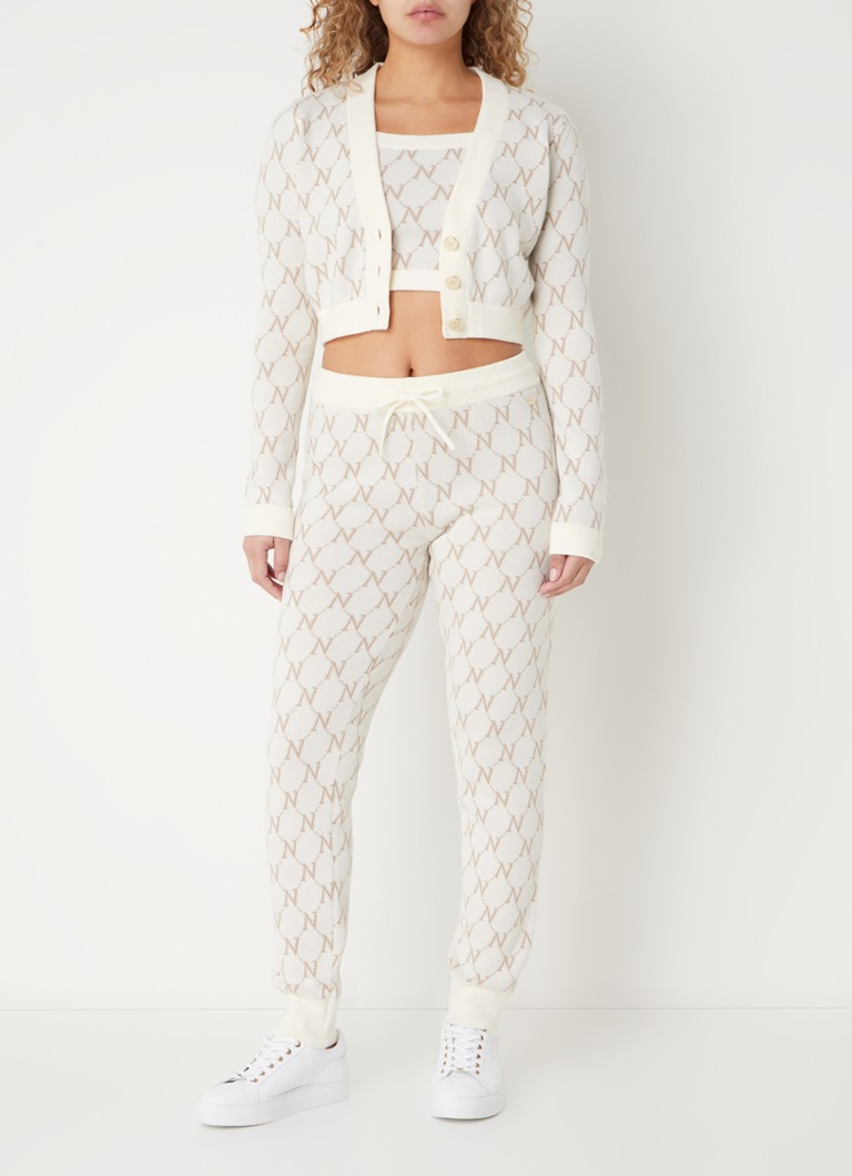 Pantaloni NIKKIE Brisbane slim fit, cu talie medie și imprimeu tricotat cu logo.