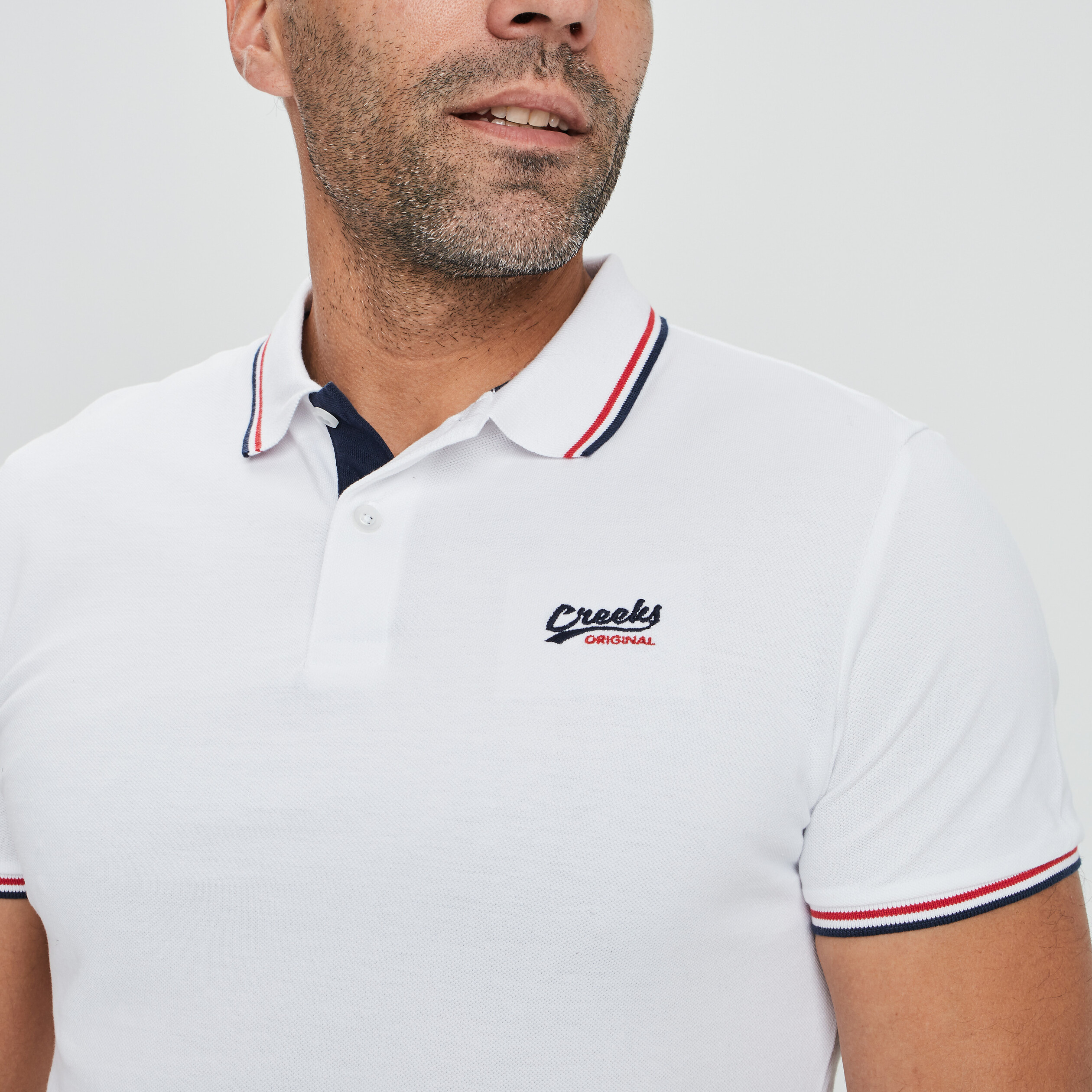 Polo avec broderie poitrine Creeks blanc homme | La Halle