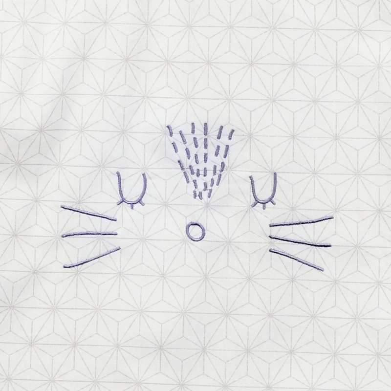 Serviette bavoir Pompom