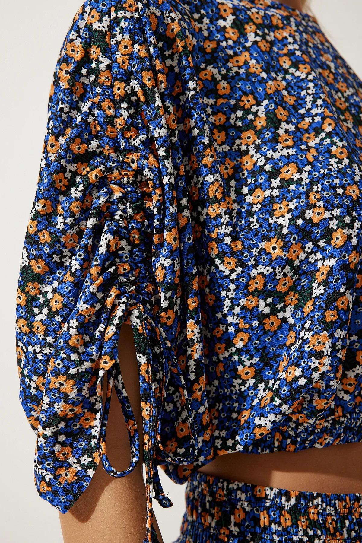 Happiness İstanbul  Blau-orange gemusterte Palazzo-Strickbluse für Damen MC00264