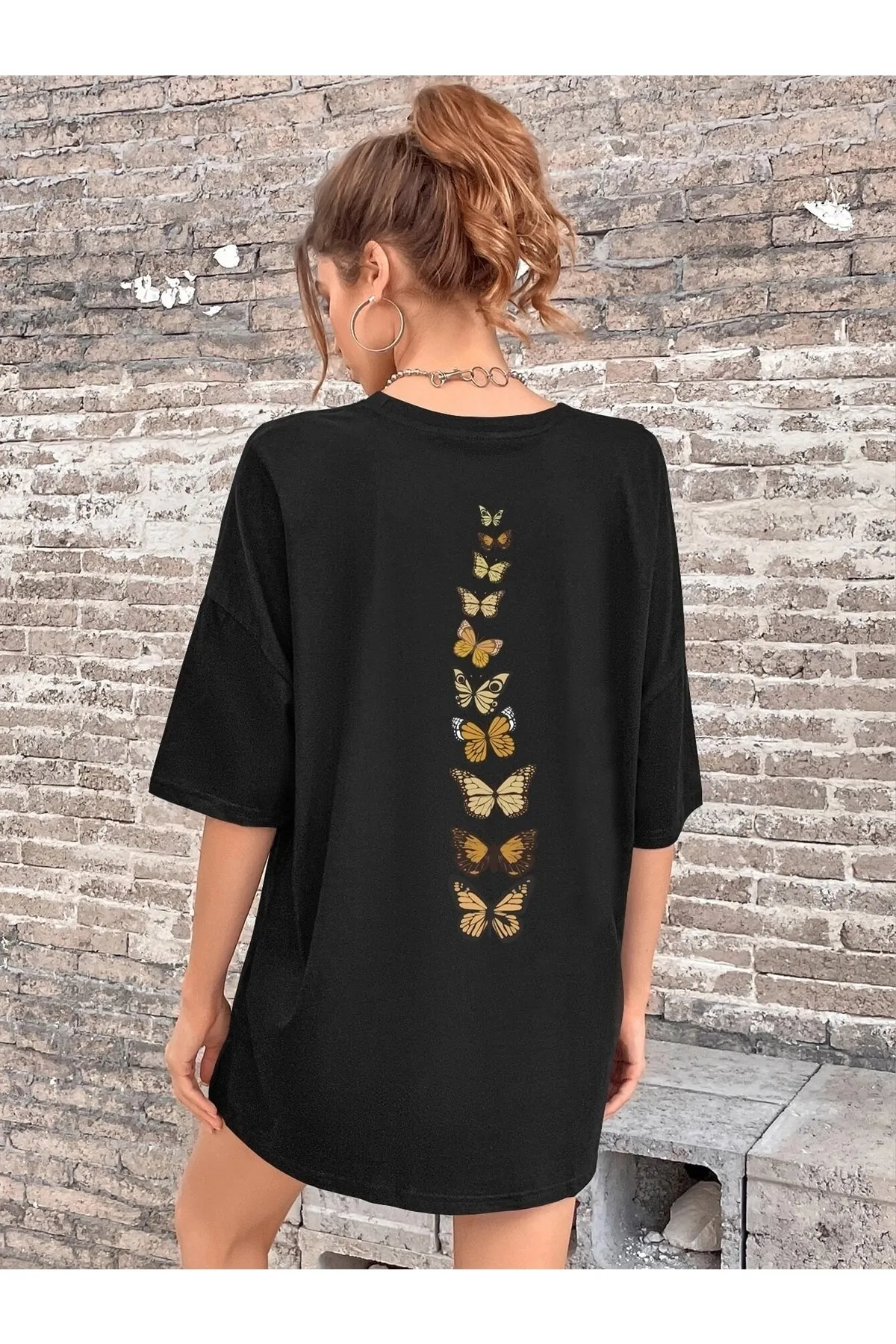Know  Schwarzes Oversize-T-Shirt mit vertikalen Schmetterlingen für Damen