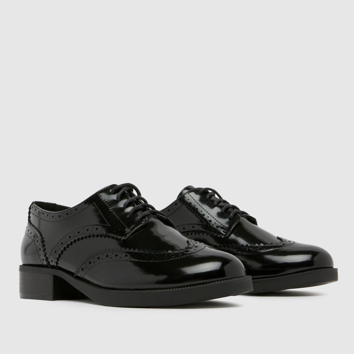 Schuh Lallie brogue lapos talpú cipők fekete színben
