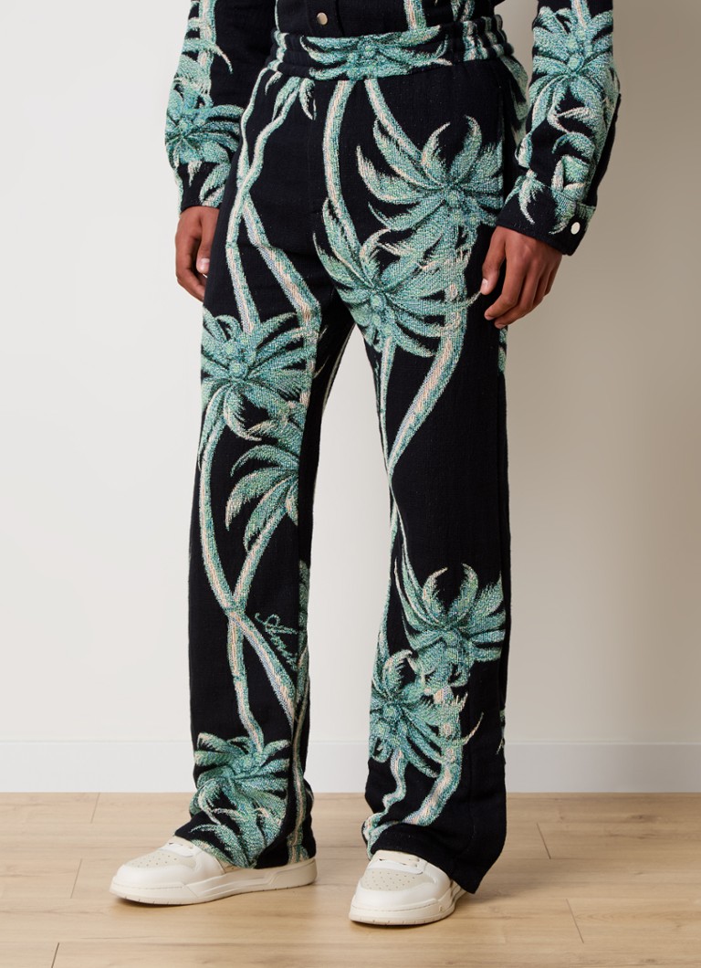 AMIRI Flared trousers with tropical print