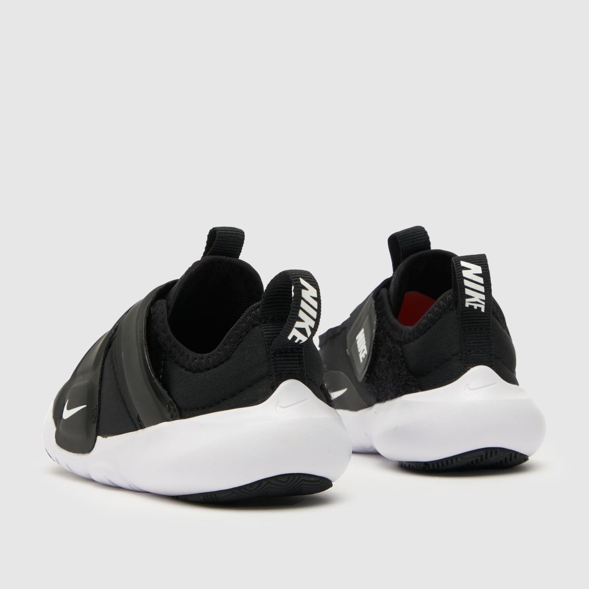 Nike Flex Advance sneakers i svart och vitt för småbarn