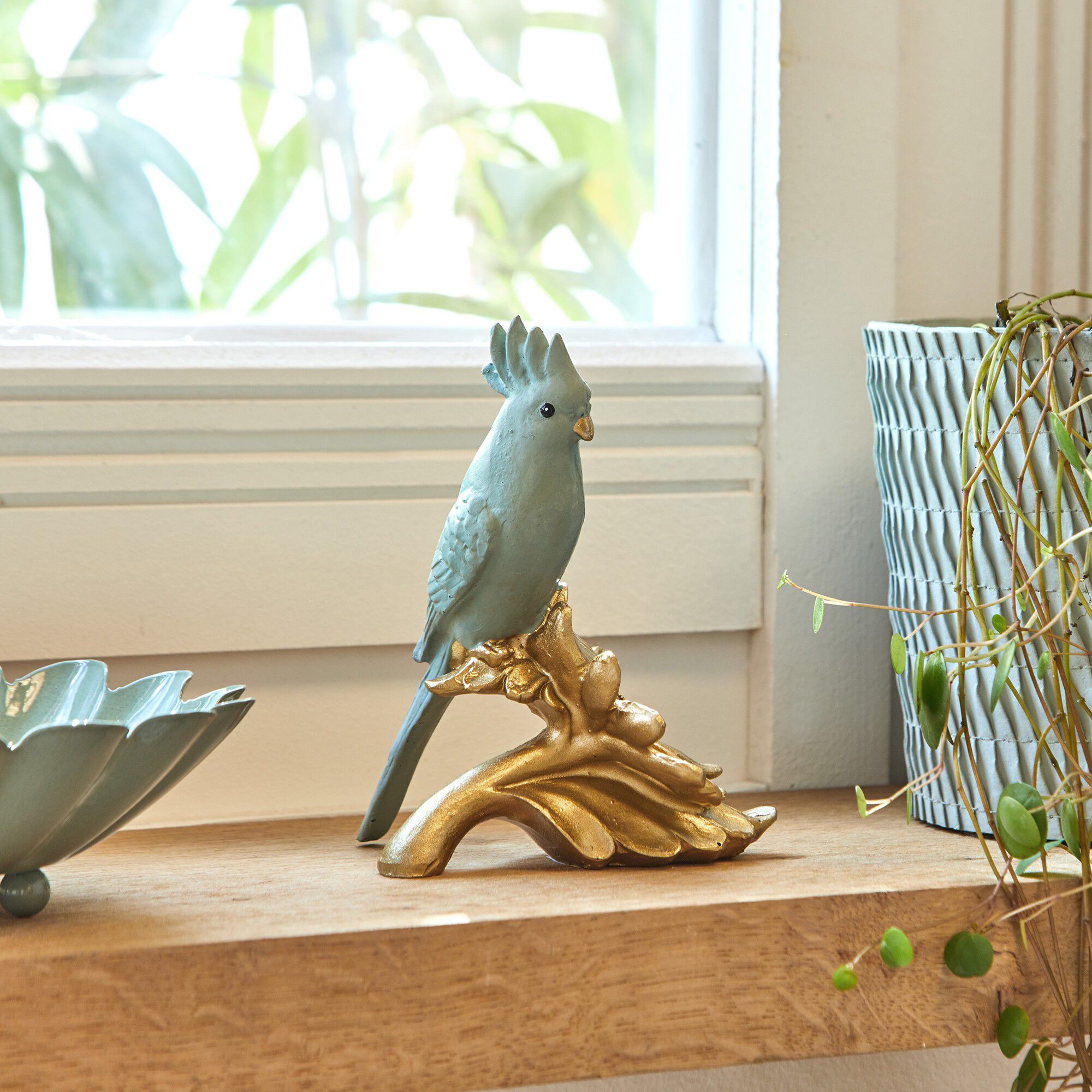 Statuette perroquet sur fleur dorée