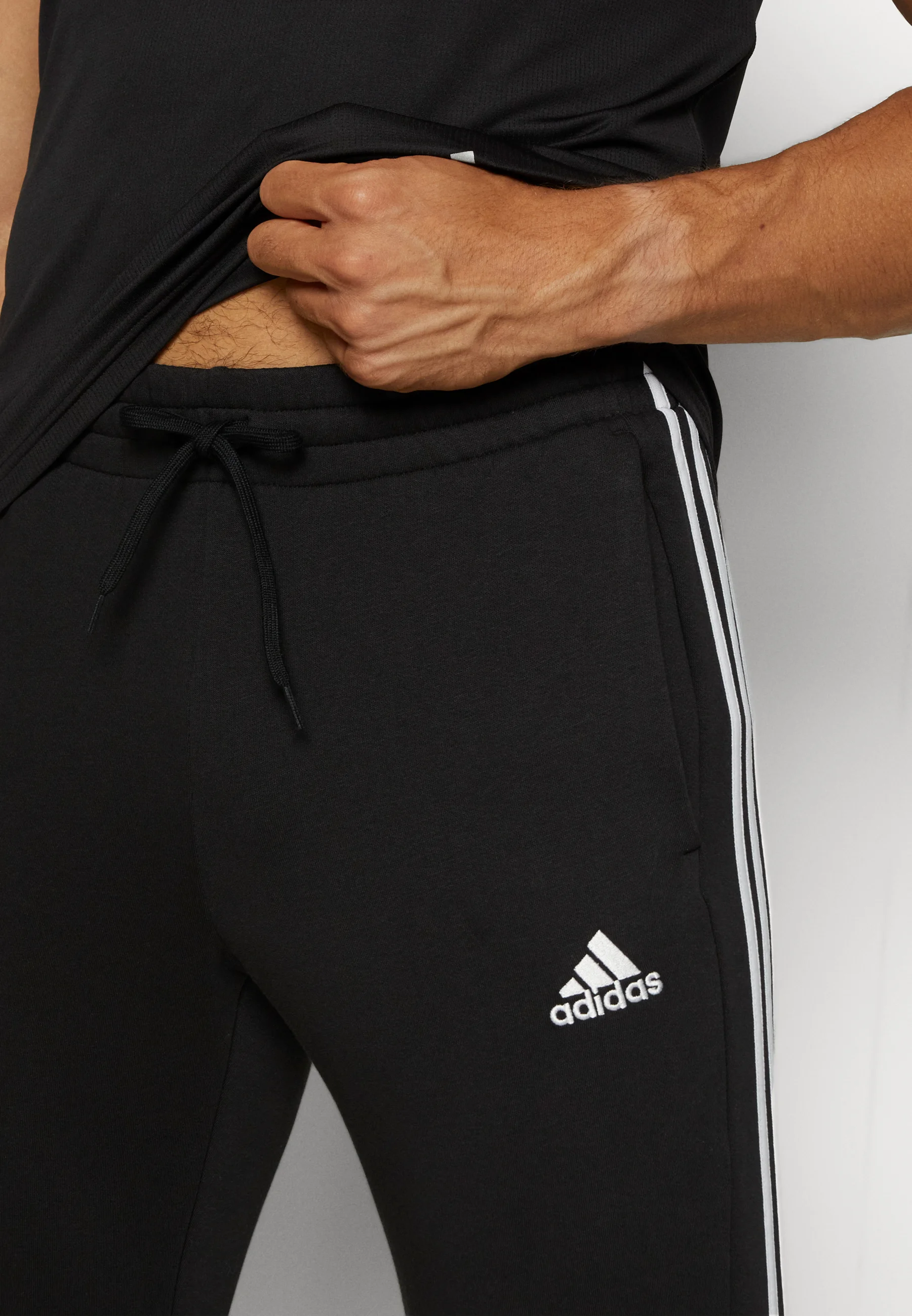adidas Sportswear ESSENTIALS TAPERED CUFF PANTS - Pantalones deportivos