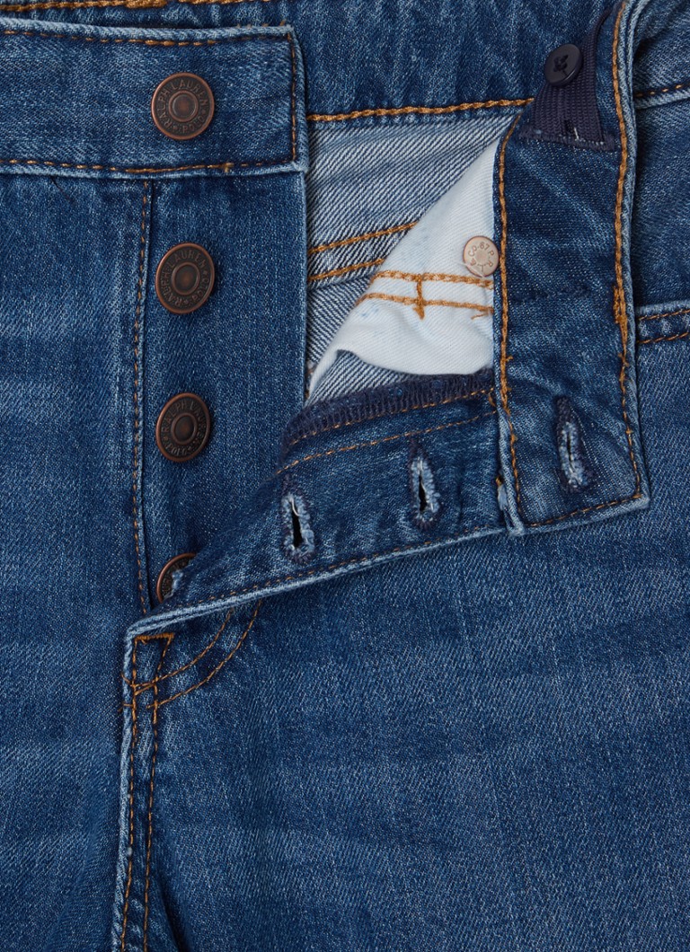 Pantaloni scurți din denim cu talie înaltă și croială largă, de la Ralph Lauren, într-o nuanță medie.