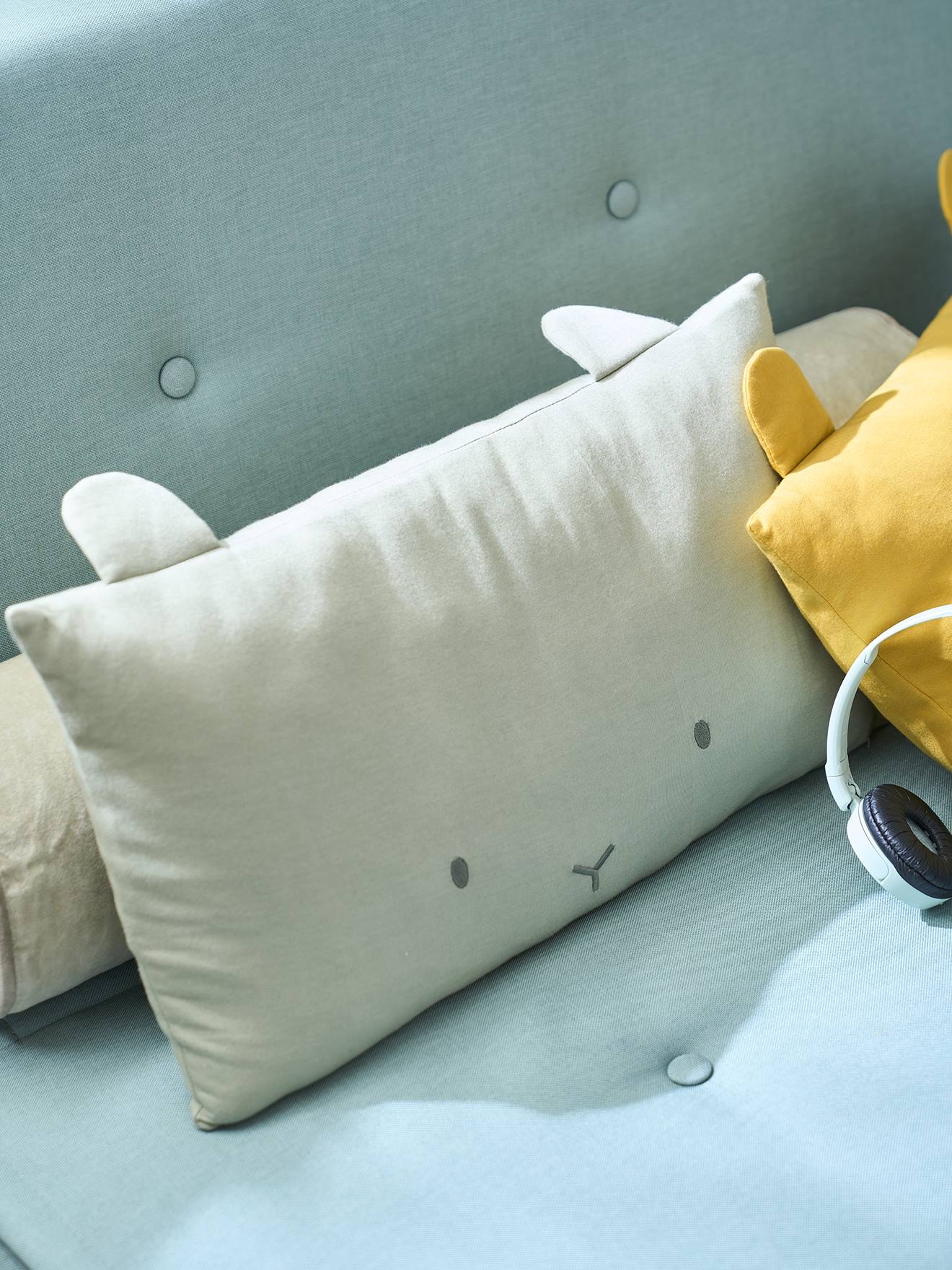 Coussin tête d'animal gris chiné