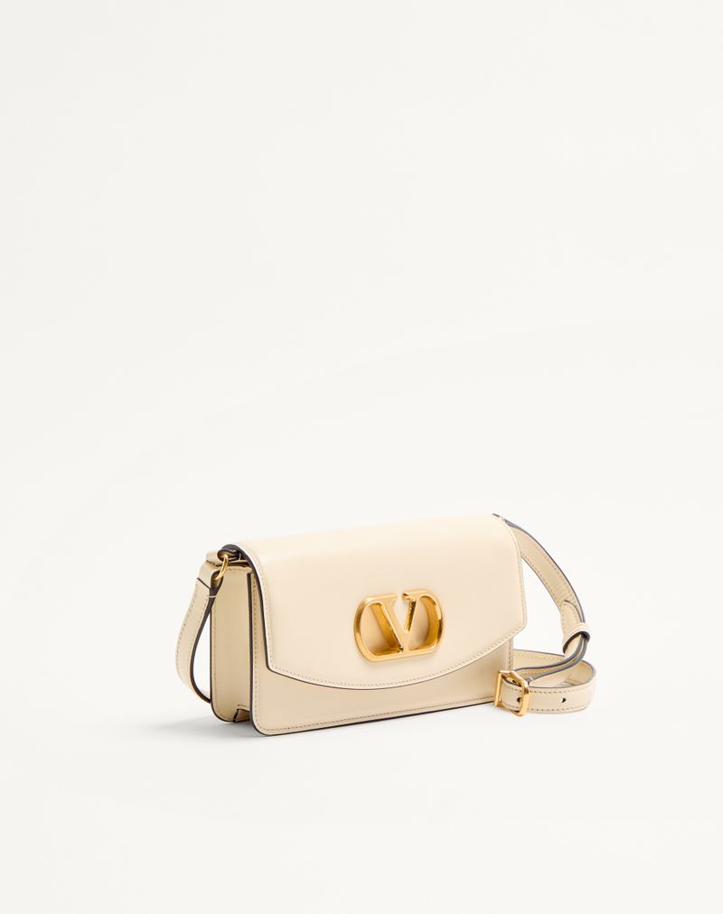 Pochette Vain de Valentino Garavani en cuir de veau brillant