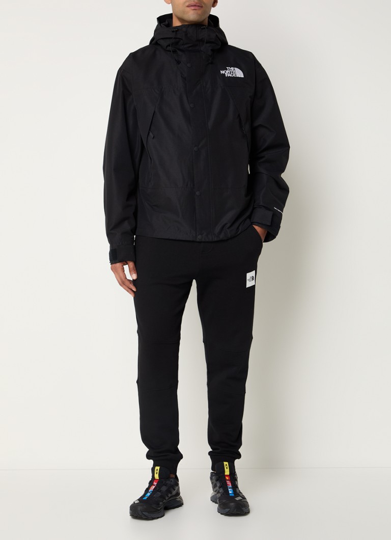 Jachetă de munte The North Face cu buzunare cu fermoar și logo.