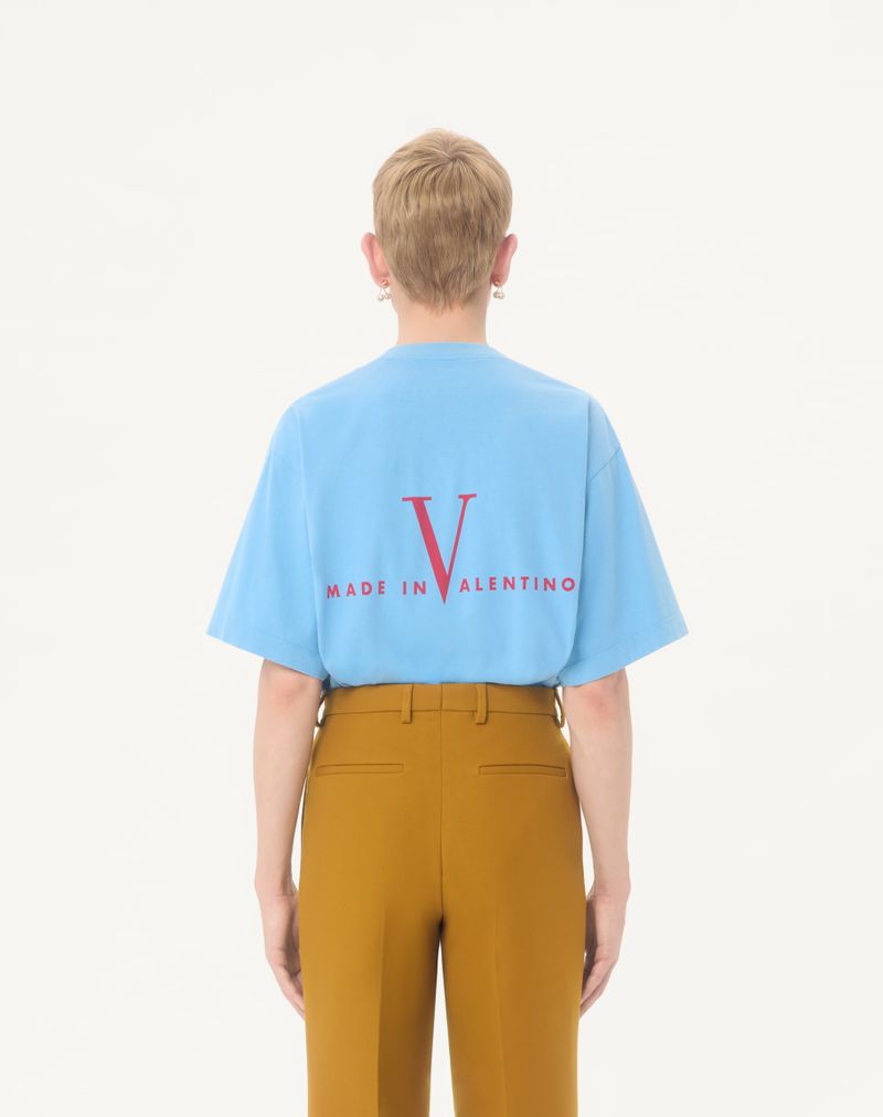 Valentino katoenen T-shirt met print 'Love Dances On The Abyss' en 'Made In Valentino'.