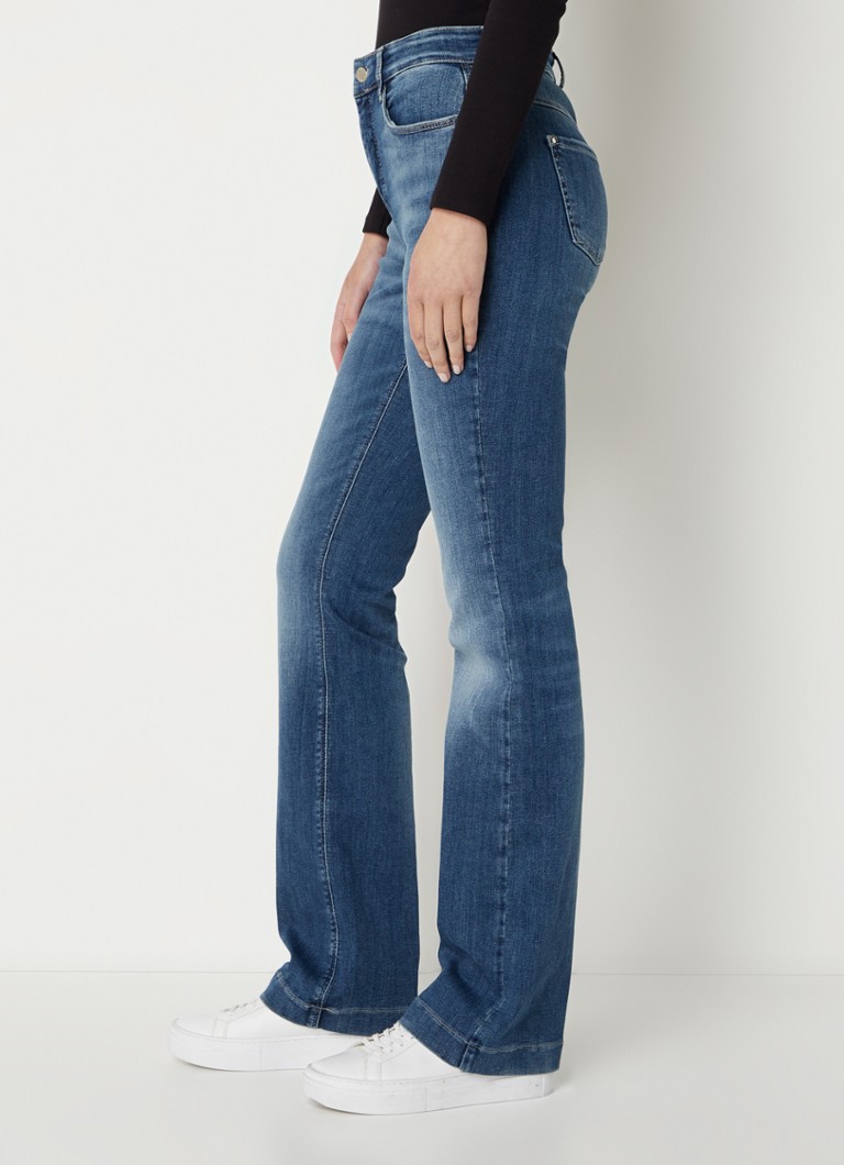 Jeansy MAC Jeans Dream ze średnim stanem i rozszerzanymi nogawkami, wykonane z elastycznego materiału.