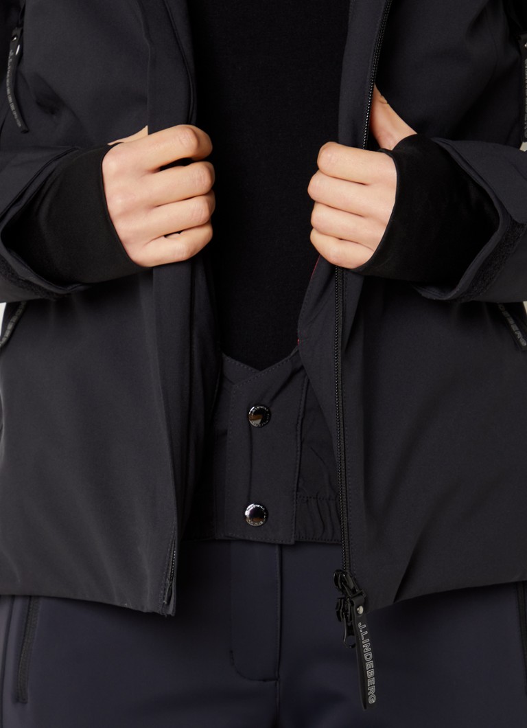 Jachetă de schi softshell J.Lindeberg Starling cu buzunare cu fermoar și logo.