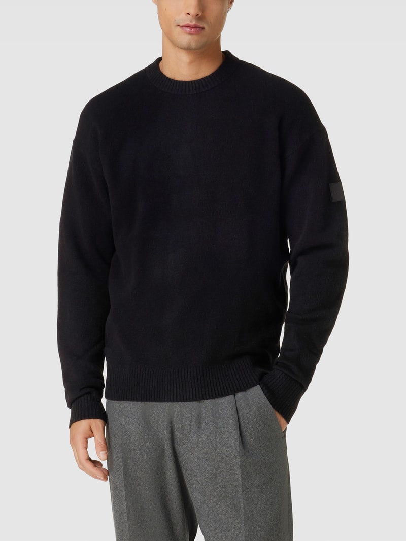 Strickpullover mit Label-Patch Modell 'LYCRA' in schwarz