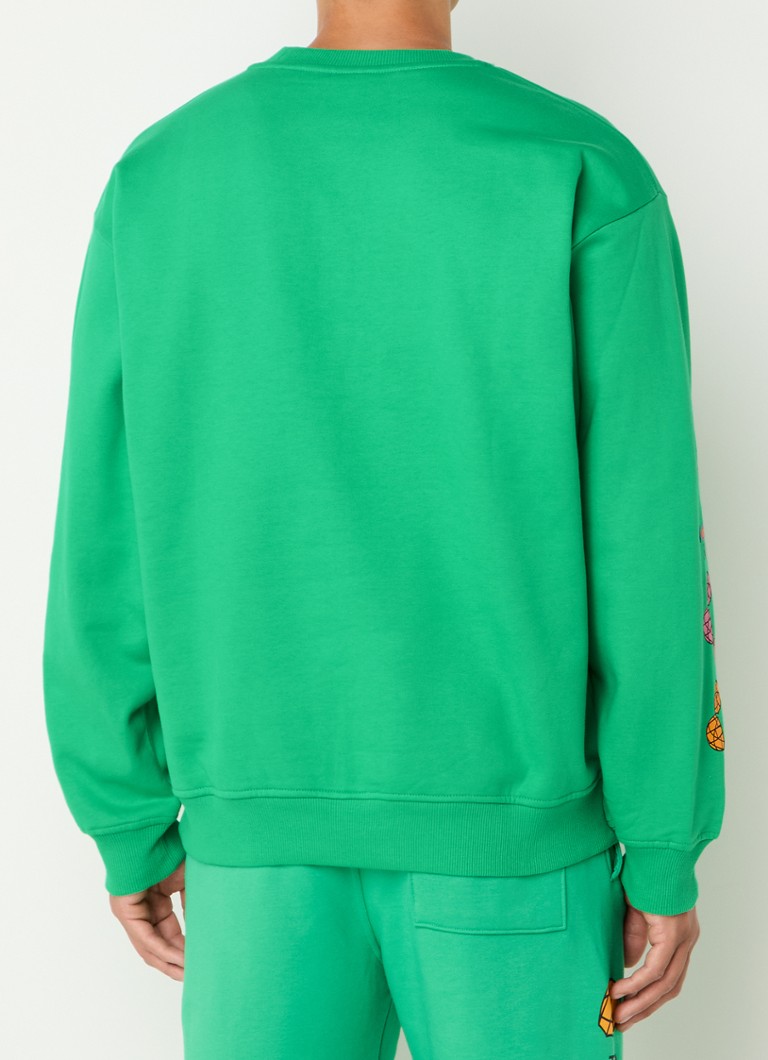 The North Face TNF x Yinka Ilori -neulepaita logopainatuksella