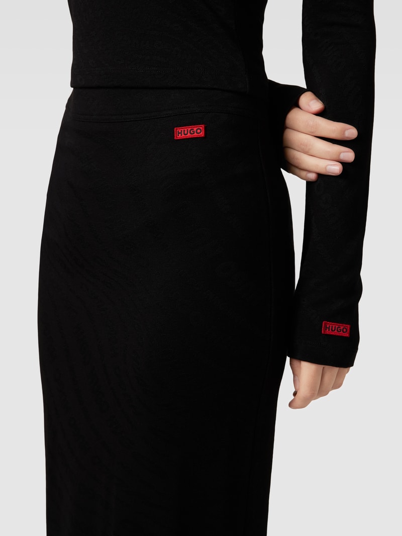 Midirock mit Allover-Label-Muster Modell 'Nolympia' in schwarz