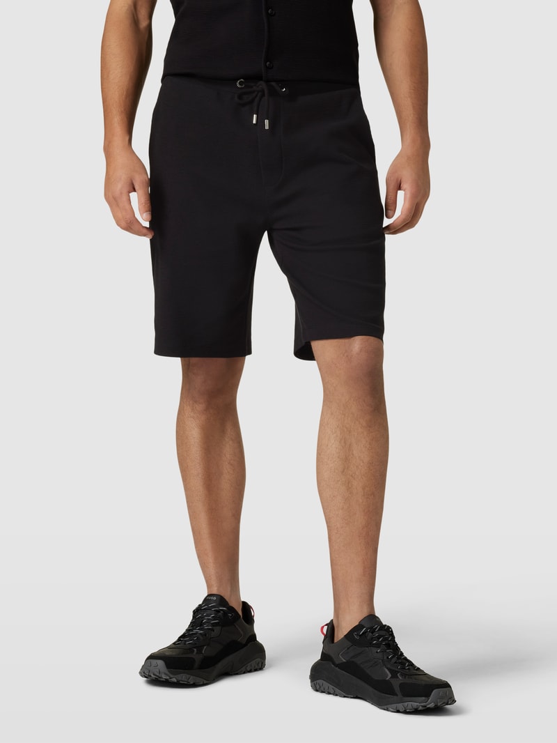 Shorts in unifarbenem Design Modell 'Waffle' in schwarz