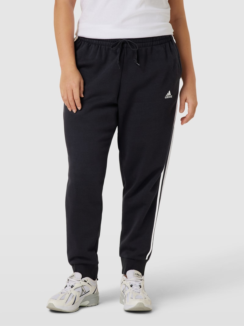 PLUS SIZE Sweatpants mit labeltypischen Galonstreifen in schwarz