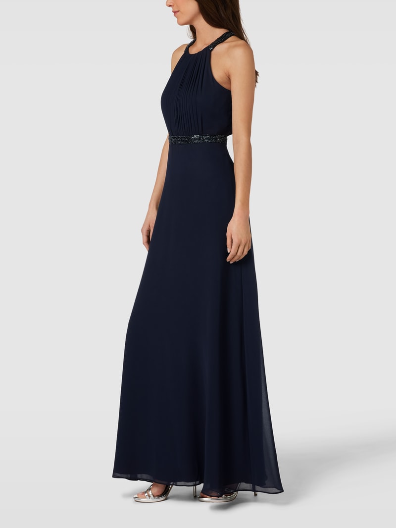 Abendkleid mit Ziersteinbesatz und Raffungen in marineblau