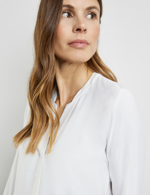 Fließende Bluse mit Kellerfalte