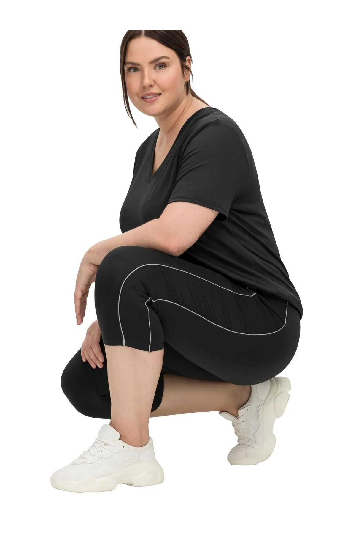 Sheego  Sport-Leggings - Schwarz - Mittlerer Bund