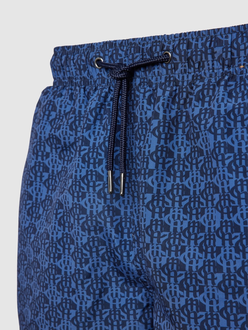 Badehose mit Allover-Label-Print in marineblau