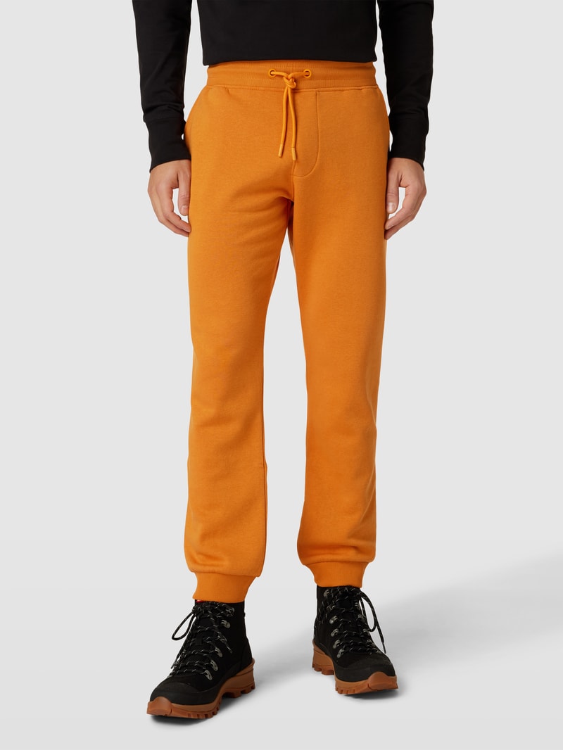 Sweatpants mit Eingrifftaschen in dunkel orange