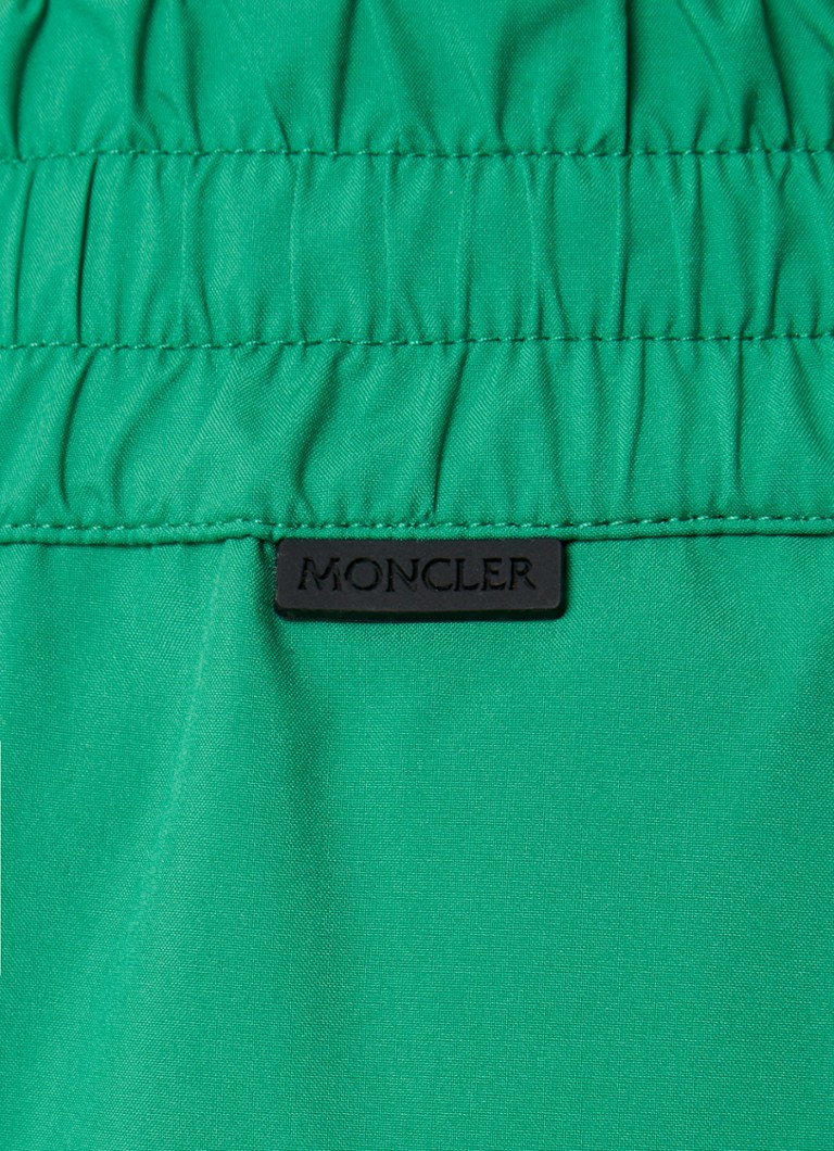 Αδιάβροχη φόρμα Moncler με ψηλή μέση και τσέπες με φερμουάρ.