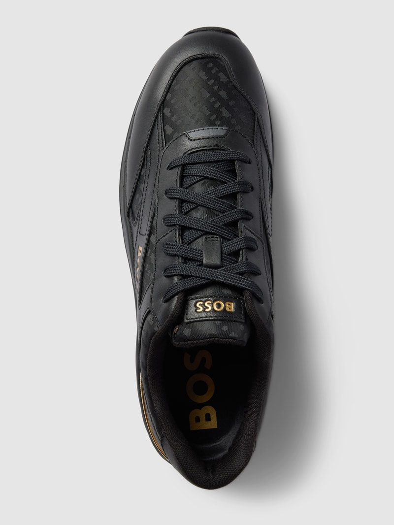 Sneaker aus Leder-Mix in schwarz