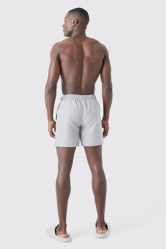 Man Signature mittellange Badehose
