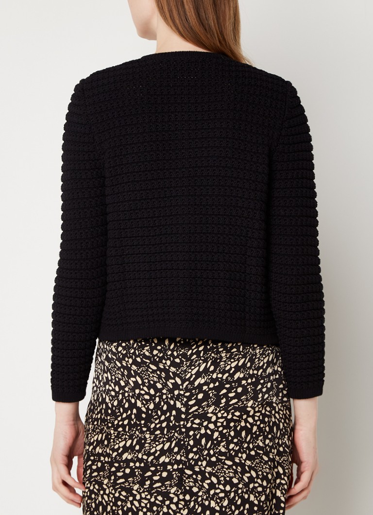 Cardigan Gaspard tricotat gros, croială scurtă și umeri cu burete, disponibil la ba&sh.