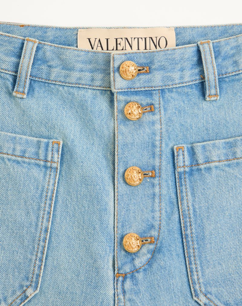 Calças jeans Valentino com botões dourados