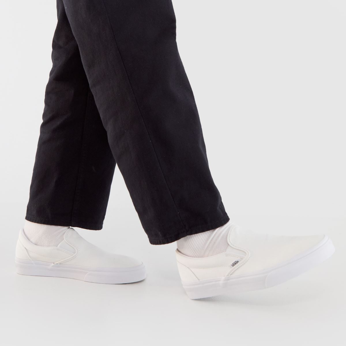 Vans – Vita klassiska slip-on-sneakers